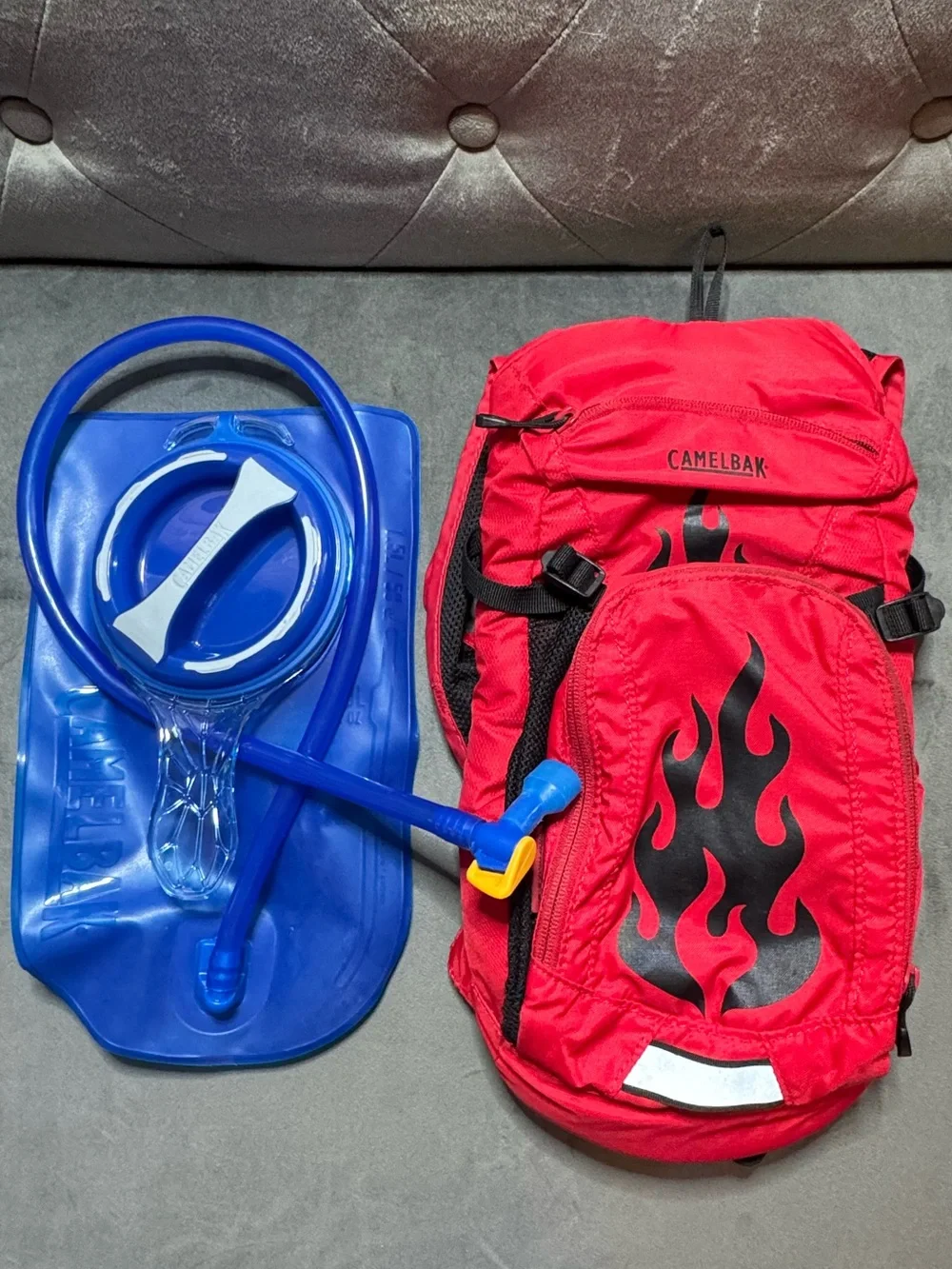 CamelBak Mini M.U.L.E. Kids’ Hydration Red Backpack with Black Flame Graphic
